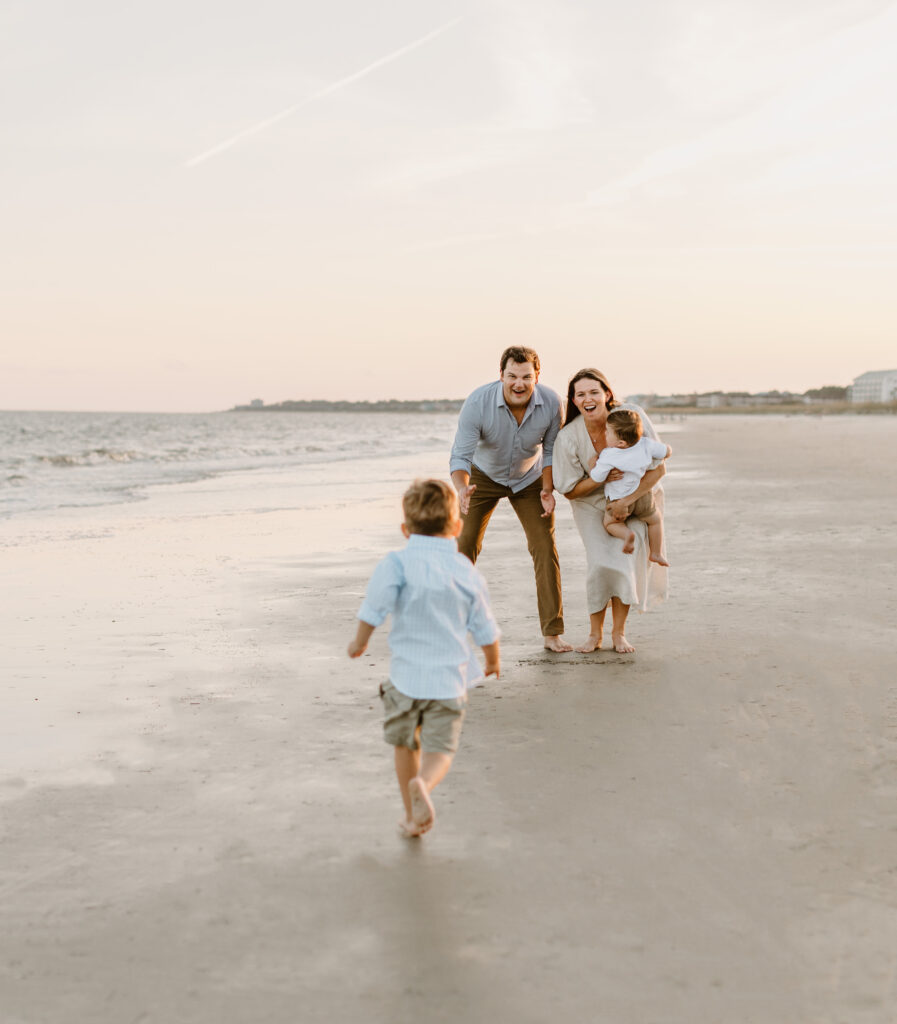 Family laughing on a Hilton Head Island beach.